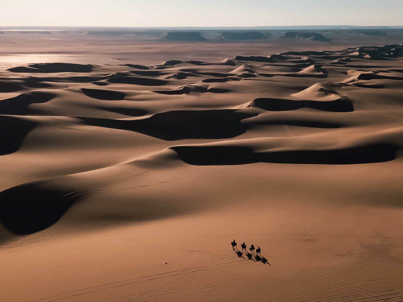 Horse riders crossing the desert dunes in Egypt during Pharaoh’s Freedom